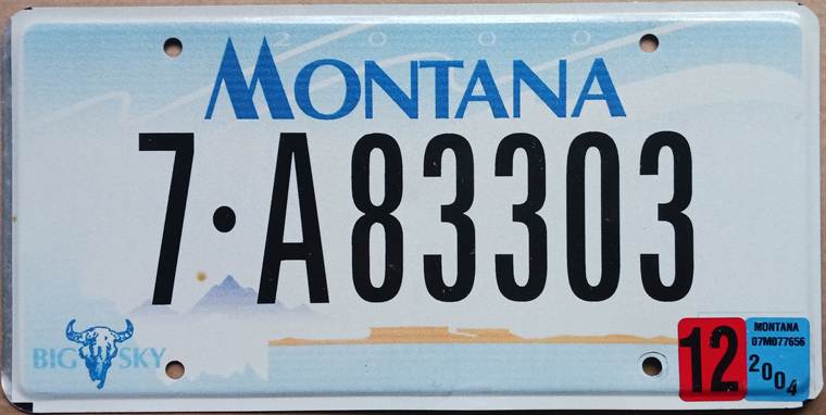 Montana license plate from the 2004 design with mountain and badlands graphics